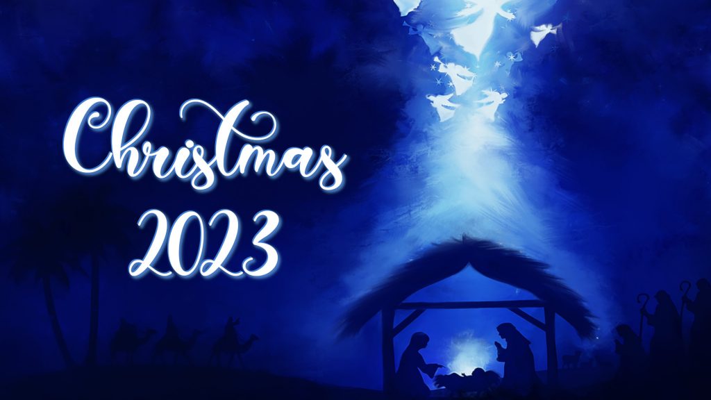 Blue painted background with manger and angels painted in white blowing trumpets over the manger. Has words "Christmas 2023" on it.