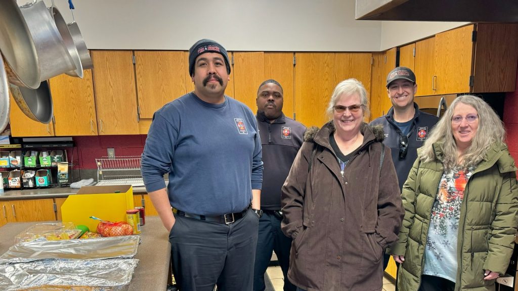 Volunteers from Emmanuel, a Manassas church, delivering a hot meal to the team at Yorkshire Fire & Rescue.